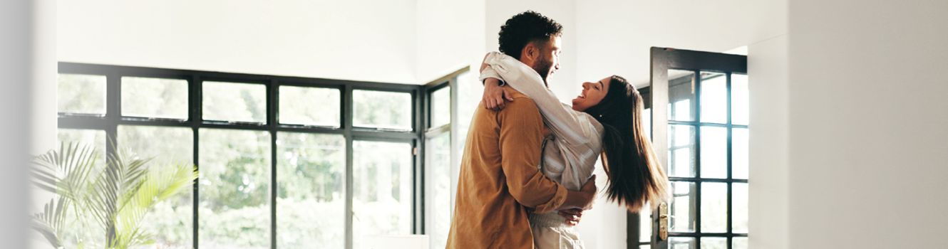 excited couple moving into new house