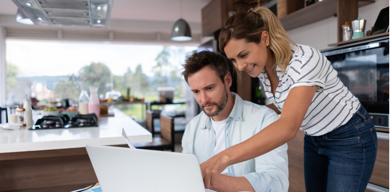 Happy Couple looking at computer