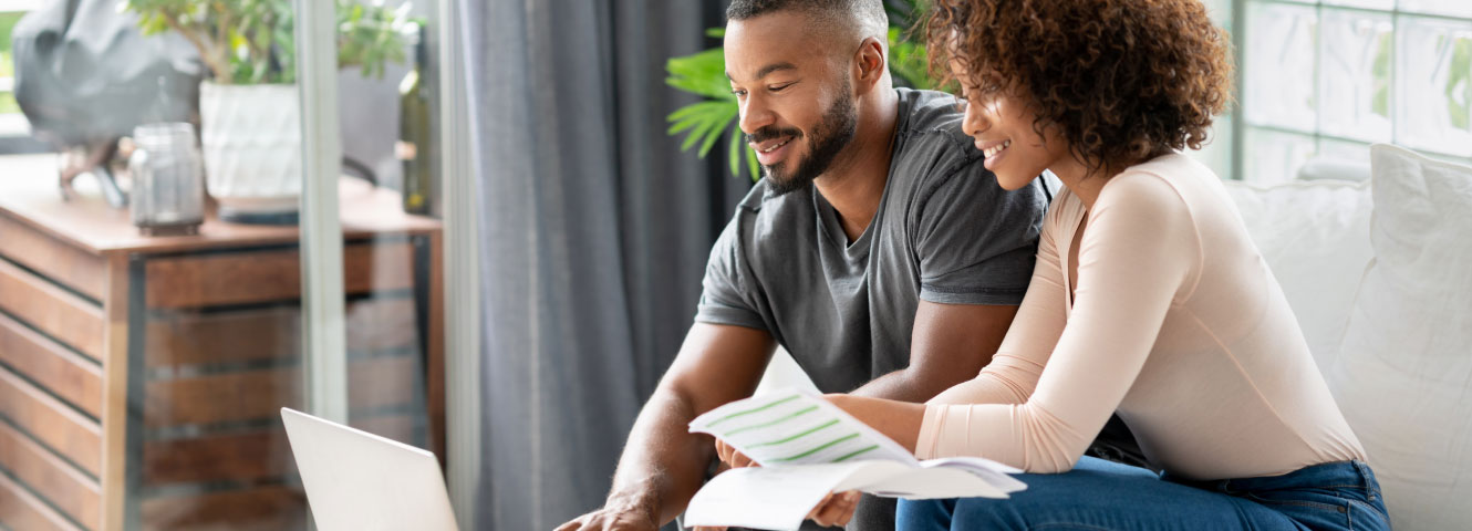 two people looking over paperwork